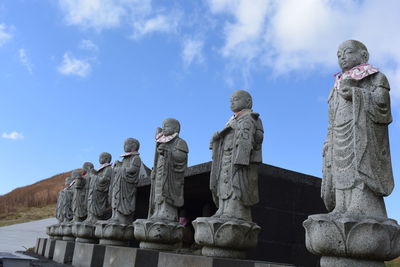 Low angle view of statue against sky