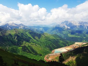 High angle view of mountains against cloudy sky