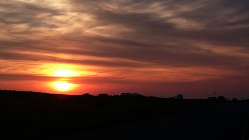 Silhouette of landscape against sunset sky