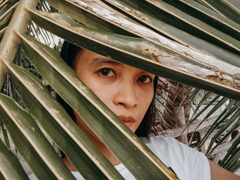 Close-up portrait of girl peeking