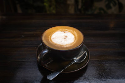 Close-up of cappuccino on table