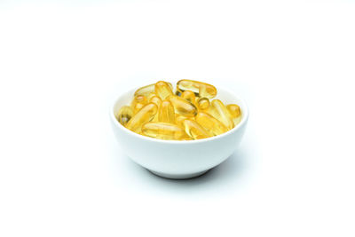 High angle view of yellow bowl on white background