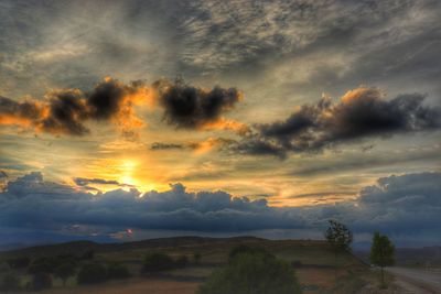 Scenic view of dramatic sky during sunset