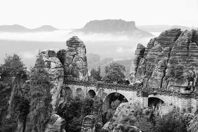 Bridge with mountain range in background