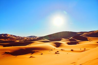 Scenic view of desert against clear sky