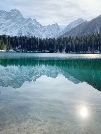 Scenic view of lake and mountains against sky