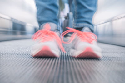 Low section of man wearing canvas shoes