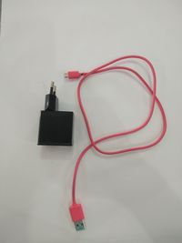 High angle view of telephone booth against wall