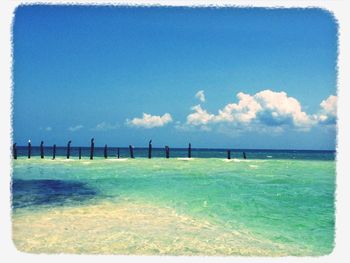 Scenic view of sea against cloudy sky