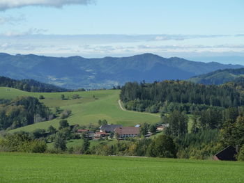 Scenic view of landscape and mountains against sky