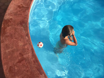 High angle view of girl in swimming pool