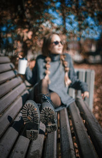 Portrait of woman sitting on bench