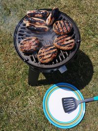 High angle view of meat on barbecue grill