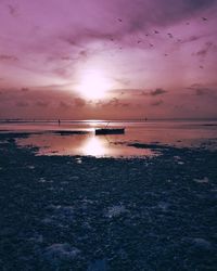 Scenic view of sea against sky at sunset