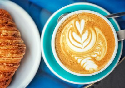 Close-up of cappuccino served on table