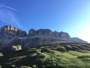 Scenic view of mountains against clear blue sky