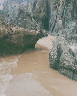 Rock formations on beach at sardinia