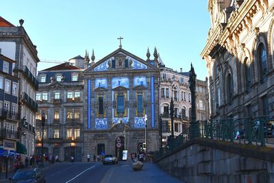 View of buildings in city against clear sky