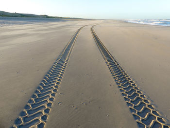 Surface level of tire tracks on beach