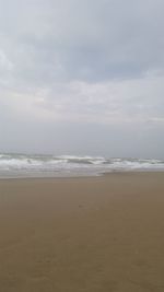 Scenic view of beach and sea against sky