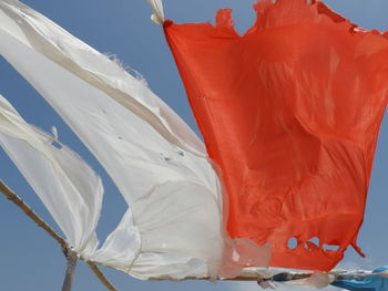 Low angle view of flag against sky