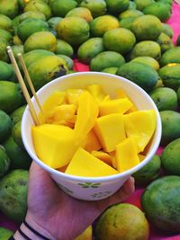 Close-up of lemons on wooden table