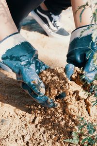 Low section of man wearing shoes