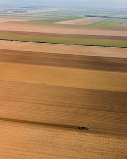 Aerial view of combine harvester on agricultural field