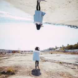 Full length of girl walking on sand