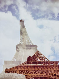 Digital composite image of eiffel tower against sky