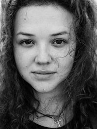 Close-up portrait of a smiling young woman