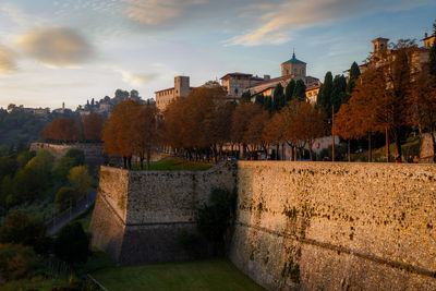 View of old building against cloudy sky