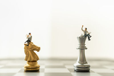 Full frame shot of chess pieces against white background