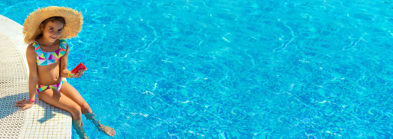 High angle view of woman swimming in pool