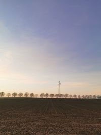 Scenic view of field against sky during sunset