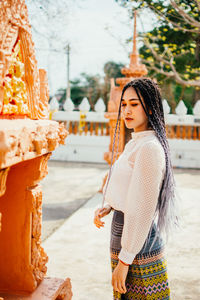 Young woman standing outdoors