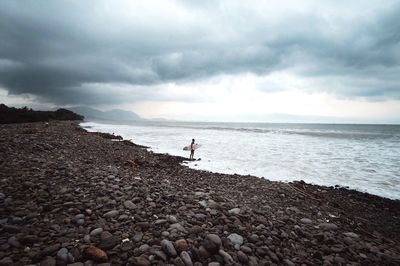 Scenic view of sea against cloudy sky