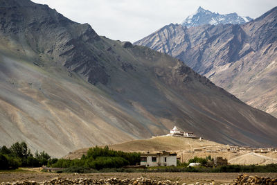 Scenic view of mountains against cloudy sky