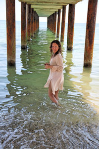 Woman standing on pier