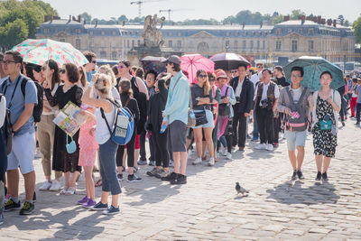 People walking on street in city