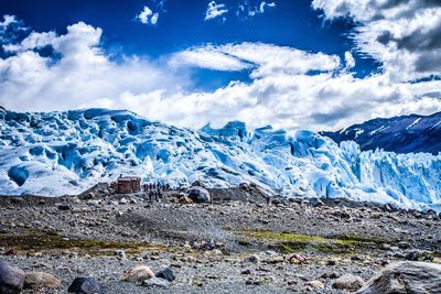Scenic view of snow covered mountains against sky