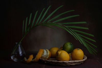 Still life with yellow and green lemons