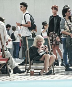 Portrait of young woman sitting on bench