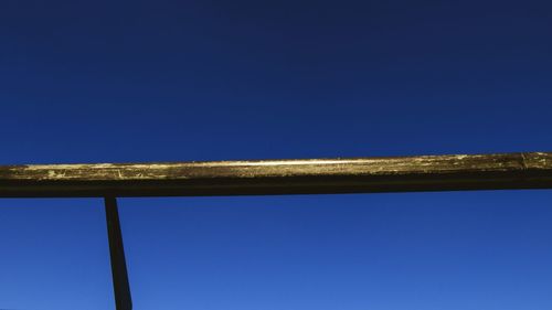 Low angle view of tree against clear blue sky