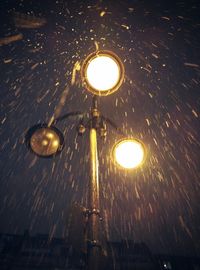 Illuminated street light at night