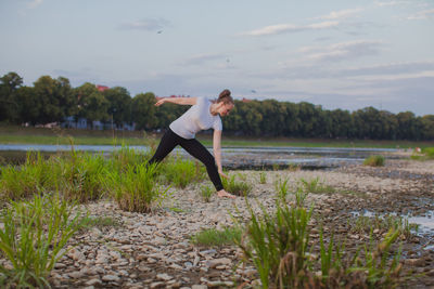 Full length of woman standing on field