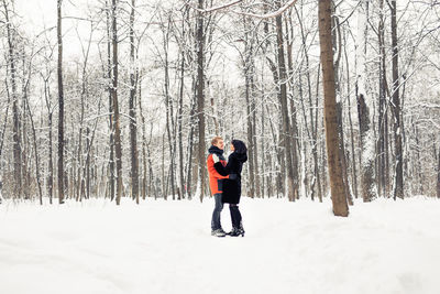 Full length of woman on snowy field during winter