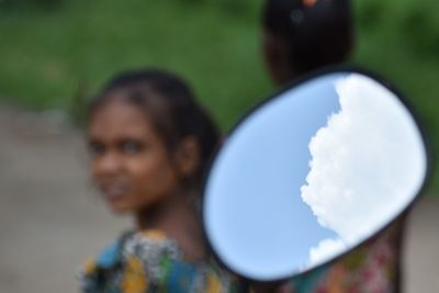 Portrait of woman against sky