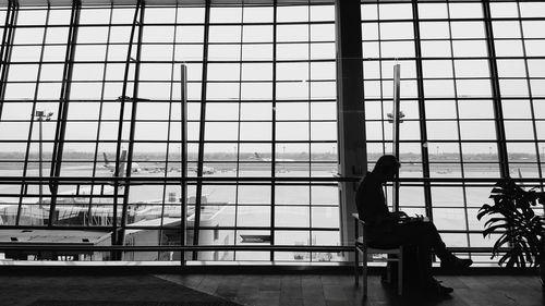 Reflection of man in airport