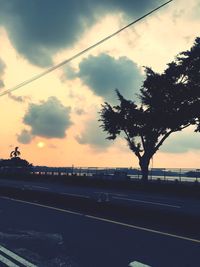 Scenic view of road against cloudy sky